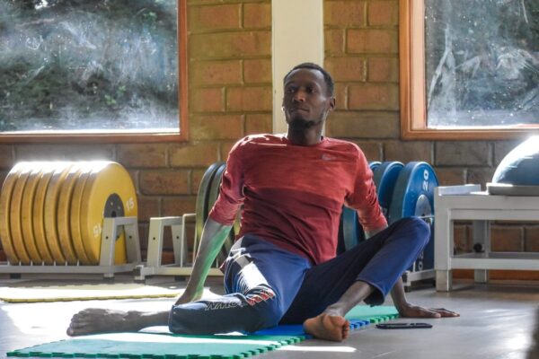 Coach Collins Kibet leading some mobility exercises