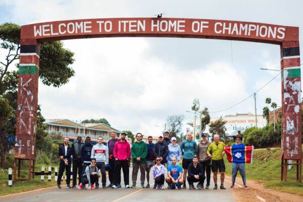 Group photo under the Iten arch